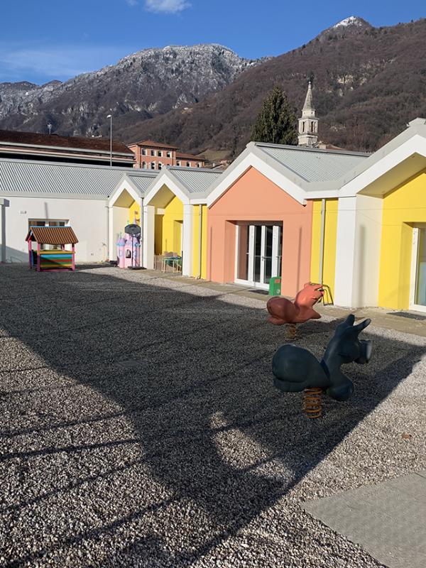 Ampliamento edificio scolastico per accorpamento scuola materna ad Alano di Piave (BL) in Via Monte Tomba